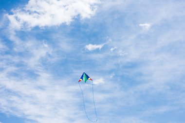 low angle view of kite with cloudy sky on background  clipart