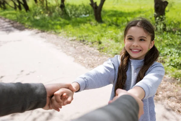 Cropped Image Man Holding Smiling Daughter Hands Park — Stock Photo, Image