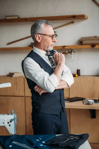 Pensive Handsome Tailor Looking Away Sewing Workshop — Stock Photo, Image