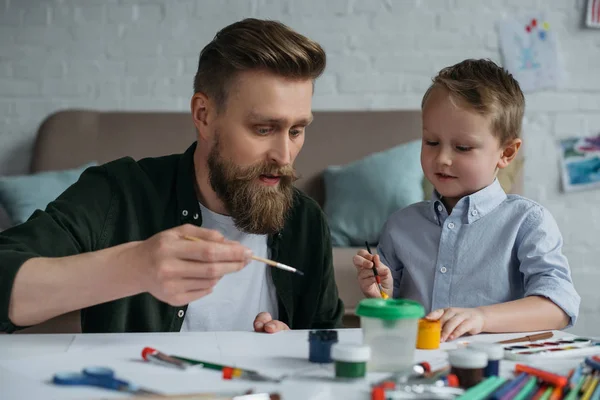 Portrait Father Cute Little Son Paints Brushes Drawing Pictures Together — Stock Photo, Image