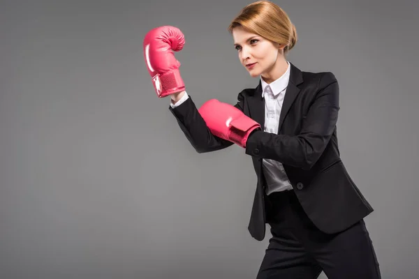 Attractive Businesswoman Suit Pink Boxing Gloves Isolated Grey — Stock Photo, Image