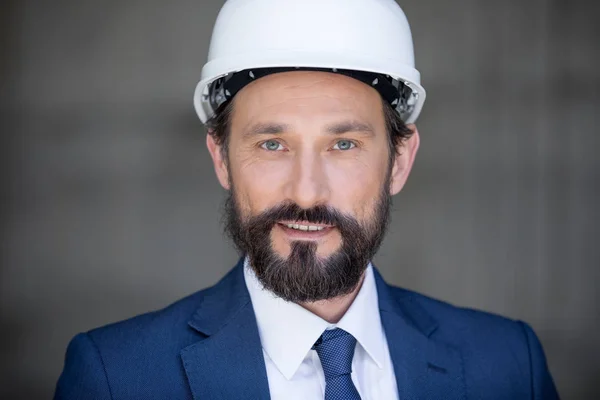 Middle aged businessman in hard hat — Stock Photo