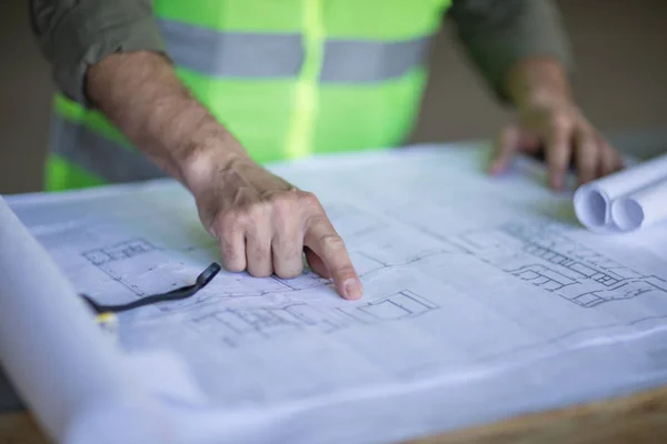 Engineer working with blueprints — Stock Photo