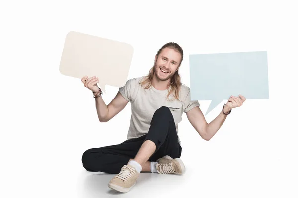 Hombre sosteniendo burbujas de habla vacía - foto de stock