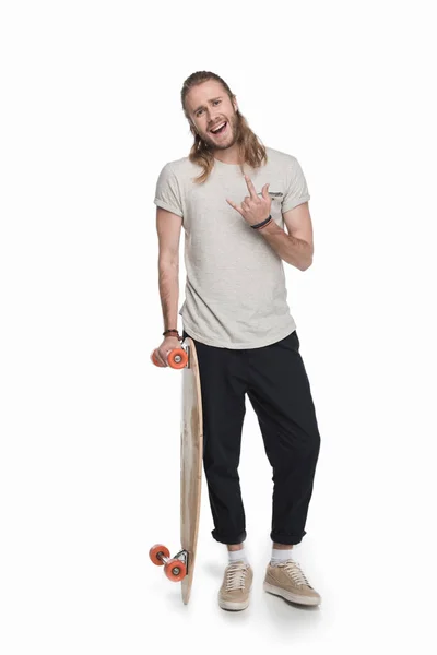 Jeune homme avec longboard — Photo de stock