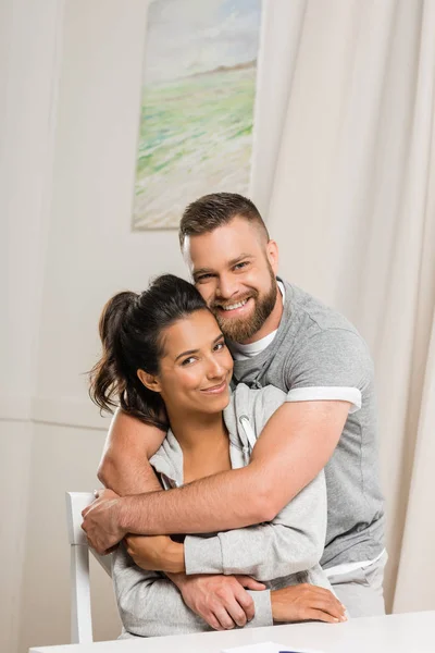 Man hugging woman — Stock Photo