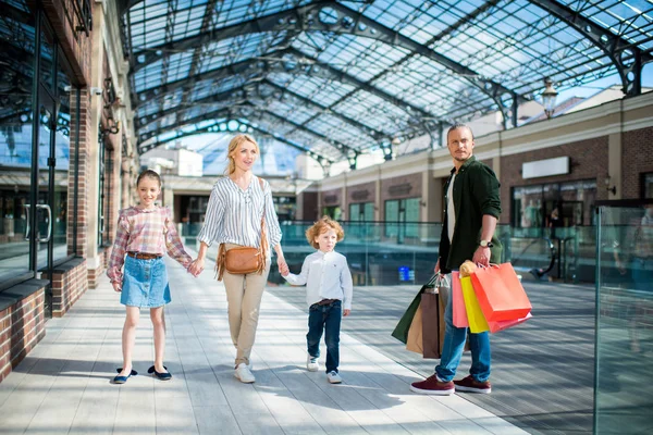 Family walking in shopping mall — Stock Photo