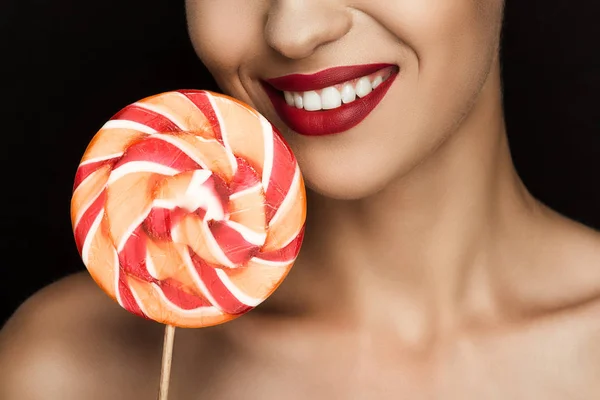 Beautiful woman with lollipop — Stock Photo