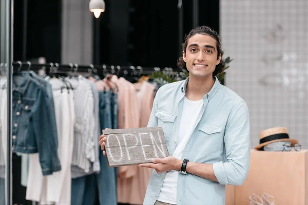Shop owner with open sign — Stock Photo