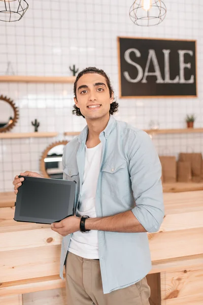 Boutique owner with digital tablet — Stock Photo