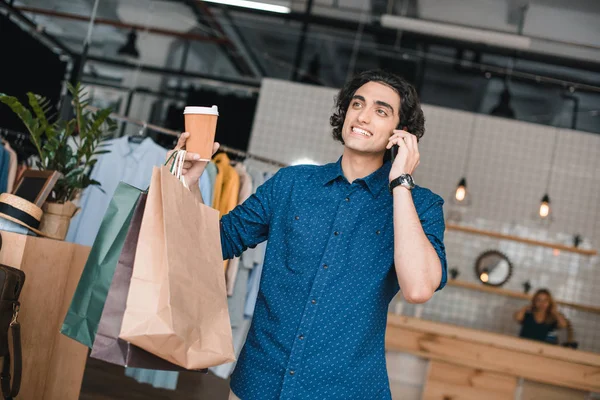 Young man with shopping bags — Stock Photo