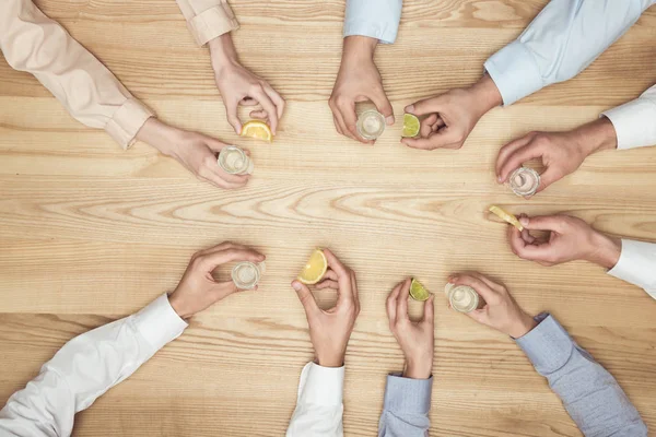 Friends with tequila shots — Stock Photo