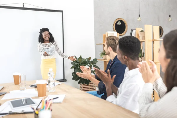 African american businesswoman presenting at meeting — Stock Photo