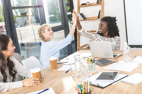 Multicultural businesswomen giving high five — Stock Photo