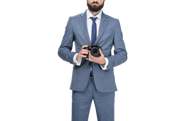 Hombre de negocios sosteniendo cámara - foto de stock