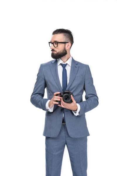 Businessman holding camera — Stock Photo