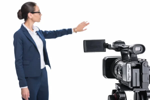 Beautiful newscaster and camera — Stock Photo