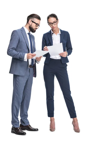 Businesspeople in suits looking at papers — Stock Photo