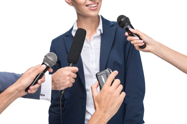 Journalists with microphones interviewing businesswoman — Stock Photo