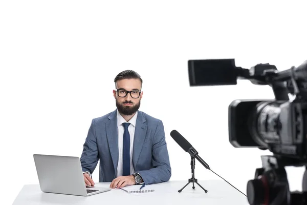 Newscaster with laptop and microphone — Stock Photo