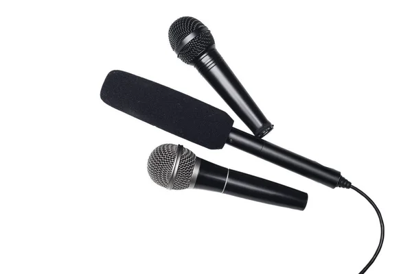 Different black microphones — Stock Photo