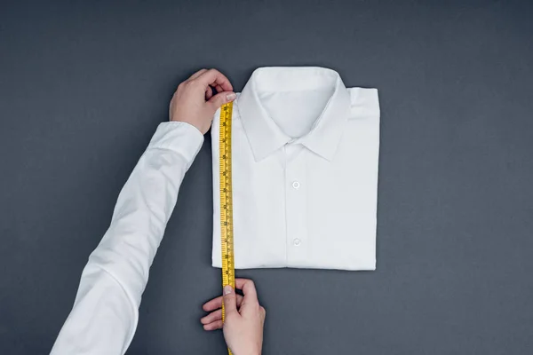 Tailor measuring shirt — Stock Photo