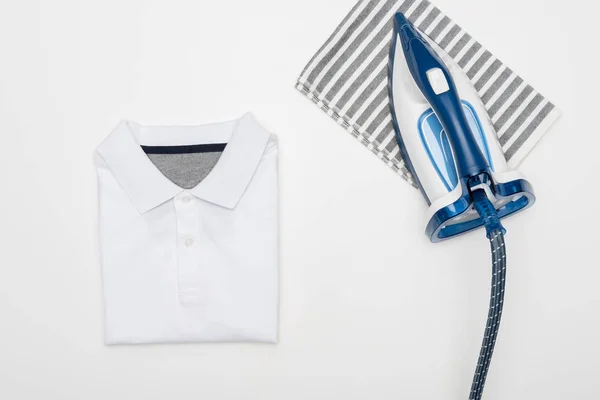 Electric iron and textile — Stock Photo