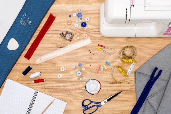 Variety of equipment for tailoring on table — Stock Photo