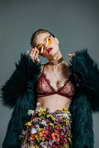 Sensual girl in lace bra and fur coat — Stock Photo