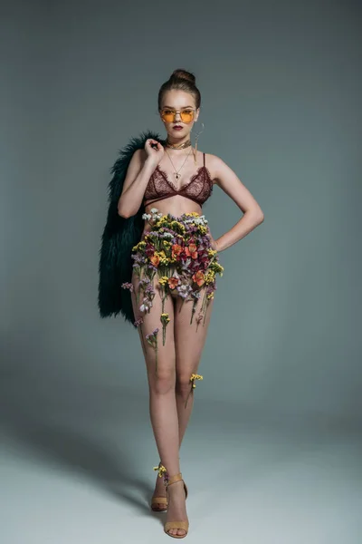 Model in floral skirt and lace bra — Stock Photo