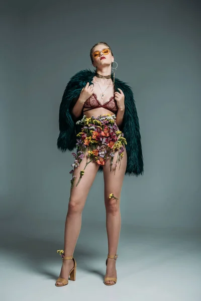 Model in floral skirt and lace bra — Stock Photo