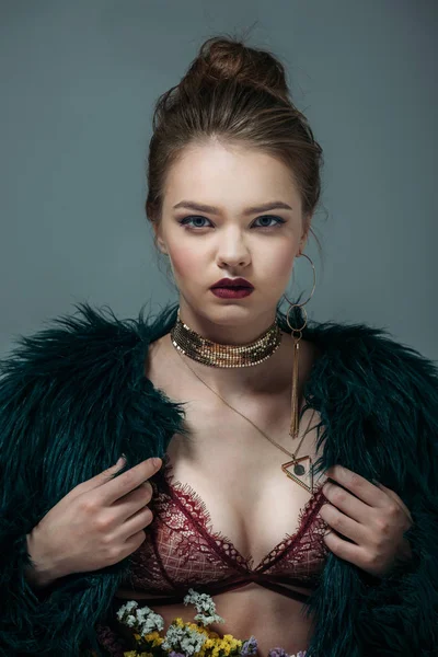 Woman in lace bra and fur coat — Stock Photo
