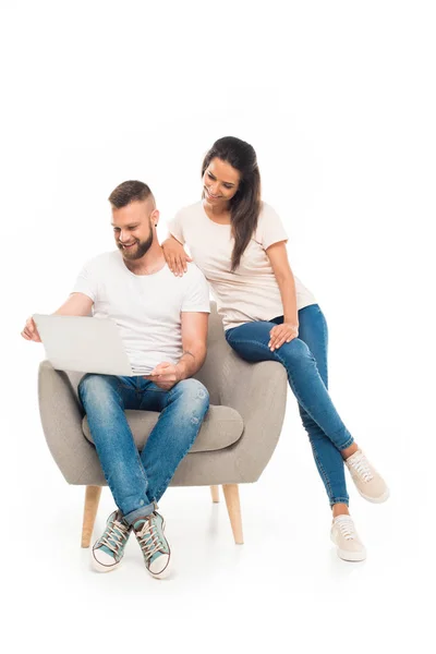 Young couple using laptop — Stock Photo