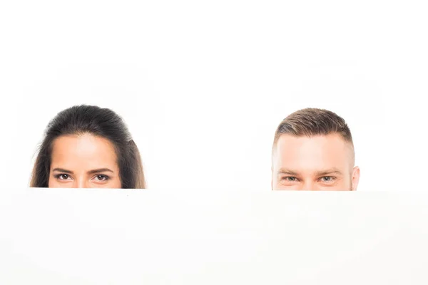 Couple looking out of banner — Stock Photo