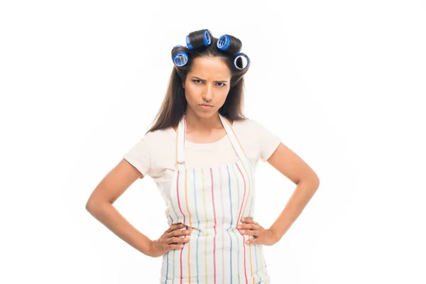 Angry housewife with hands on hips — Stock Photo