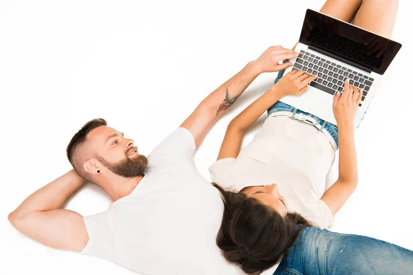 Young couple using laptop — Stock Photo