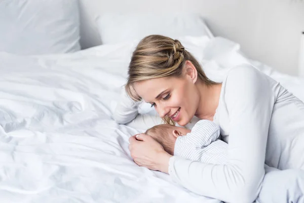Mother hugging her baby — Stock Photo