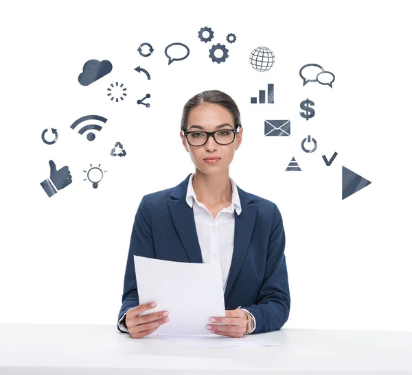 Newscaster with papers looking at camera — Stock Photo