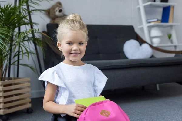 Little schoolgirl with backpack — Stock Photo