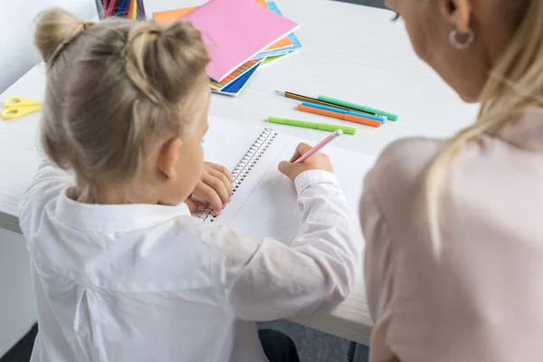 Child drawing with mother — Stock Photo
