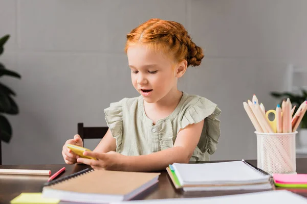 Little girl with calculator — Stock Photo