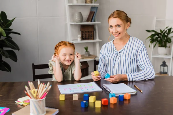 Mother and daughter learning math at home — Stock Photo