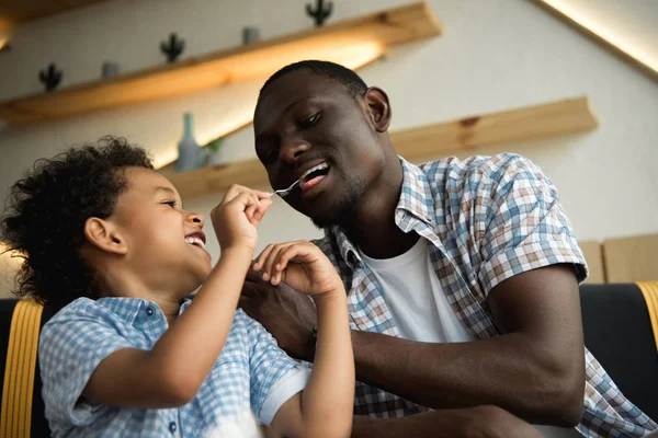 Happy father and son in cafe — Stock Photo