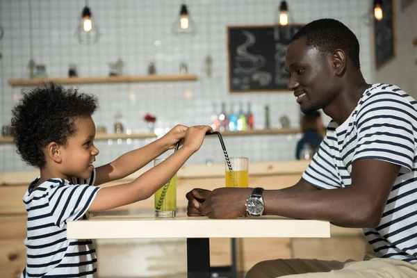 Happy father and son in cafe — Stock Photo