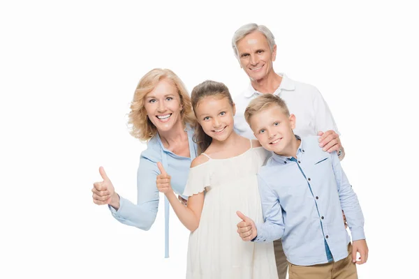 Abuelos y nietos mostrando pulgares hacia arriba - foto de stock