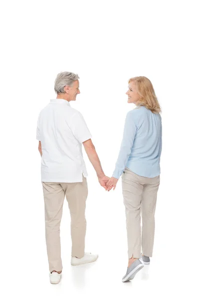Mature couple holding hands — Stock Photo