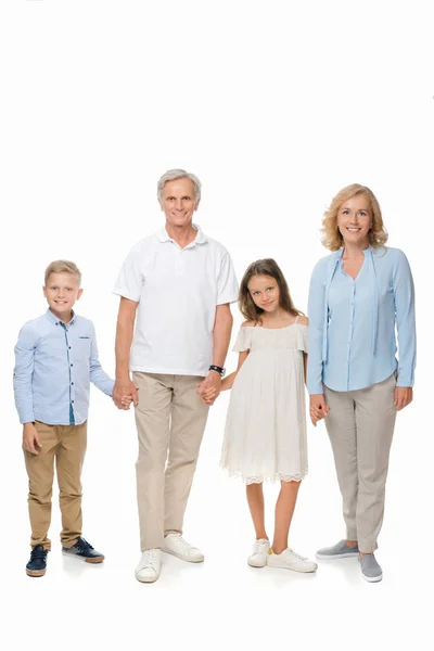 Grandparents and kids holding hands — Stock Photo