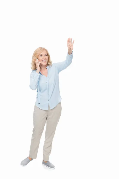 Mature woman talking by phone — Stock Photo