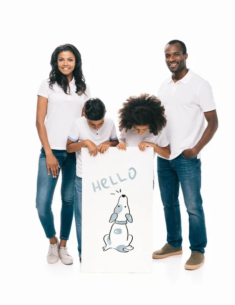 Happy african american family with banner — Stock Photo