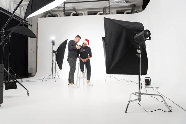 Photographer working in studio with model — Stock Photo